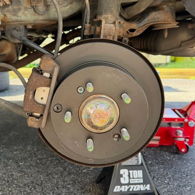 The same wheel with a new rotor fitted and the caliper back on